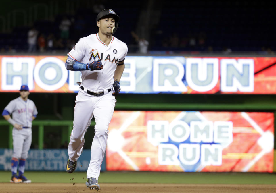 Giancarlo Stanton circling the bases after home run No. 55 on Monday night. (AP)