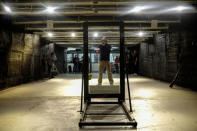 Armoured One Tactical Consultant Michael Poland poses as he prepares to shoot one of the company's security glass for an active shooter preparedness drill demonstration at Rockland Indoor Shooting, in Pearl River, New York, U.S., December 12, 2017. REUTERS/Eduardo Munoz