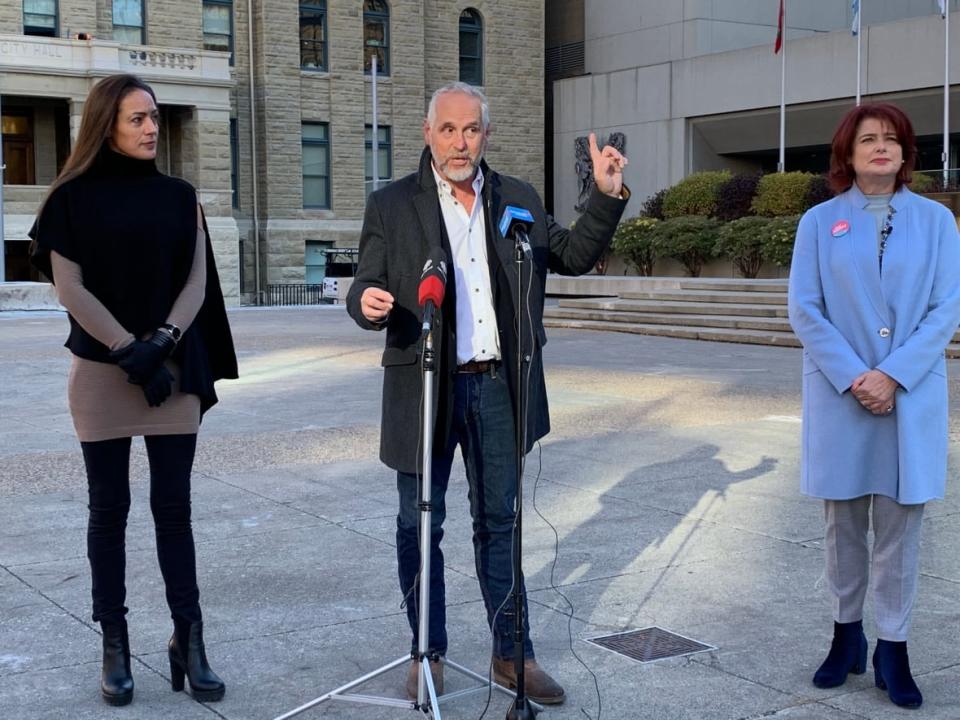 Virginia Stone, left, Zane Novak, centre, and Jan Damery, right, made an appeal for Calgarians to consider mayoral candidates beyond the council incumbents ahead of Monday's municipal election. (Mike Symington/CBC - image credit)