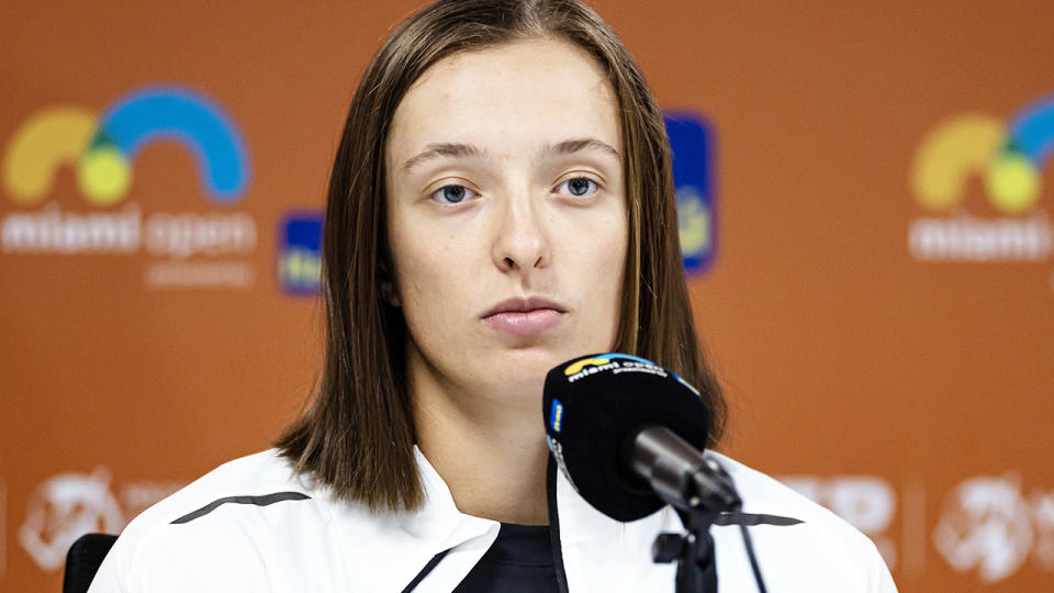 Iga Swiatek, pictured here speaking to reporters after announcing her withdrawal from the Miami Open.