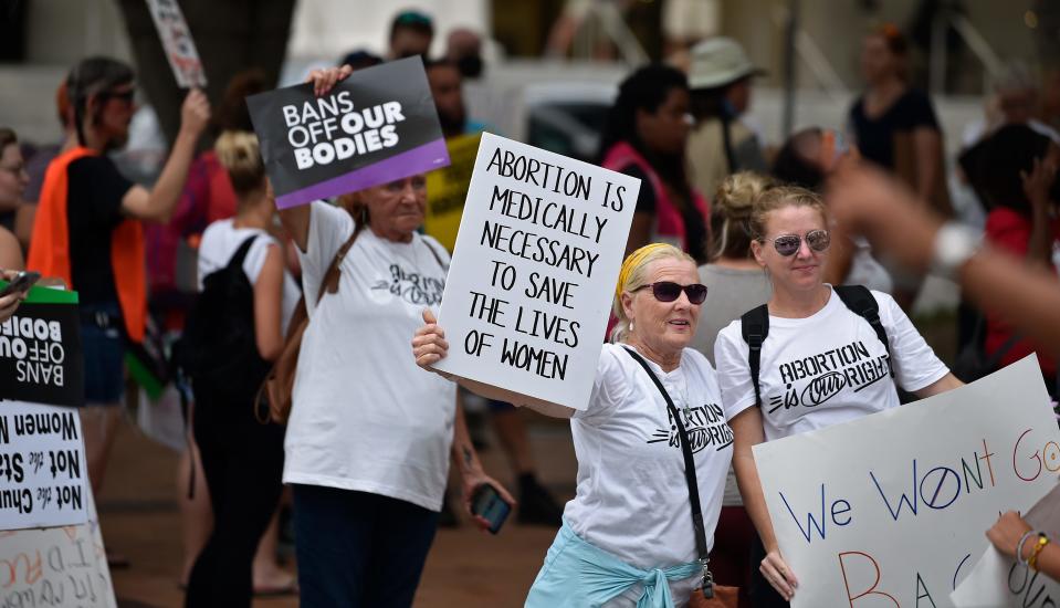 'We Dissent' protest in downtown Sarasota had some 200 demonstrators that gathered at Selby Five Points Park and marched to the Judge Lynn N. Silvertooth Judicial Center, while while braving rain and lightning. The United States Supreme Court reversed its landmark 1973 decision in Roe v. Wade, which established a constitutional right to abortion, on Friday, June 24, 2022, leaving responsibility for the procedure's legality to the states.