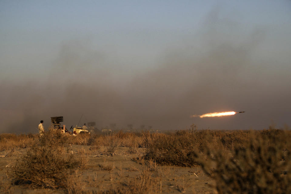 This photo released Tuesday, Jan. 19, 2021, by the Iranian Army, shows a missile being fired during a military drill. Iran's military kicked off a ground forces drill on Tuesday along the coast of the Gulf of Oman, state TV reported, the latest in a series of snap exercises that the country is holding amid escalating tensions over its nuclear program and Washington's pressure campaign against Tehran. (Iranian Army via AP)