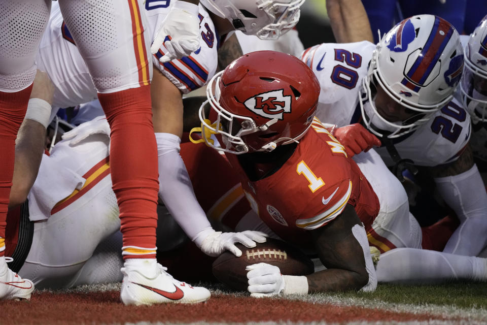 Kansas City Chiefs running back Jerick McKinnon (1) scores during the first half of an NFL football game against the Buffalo Bills Sunday, Dec. 10, 2023, in Kansas City, Mo. (AP Photo/Charlie Riedel)
