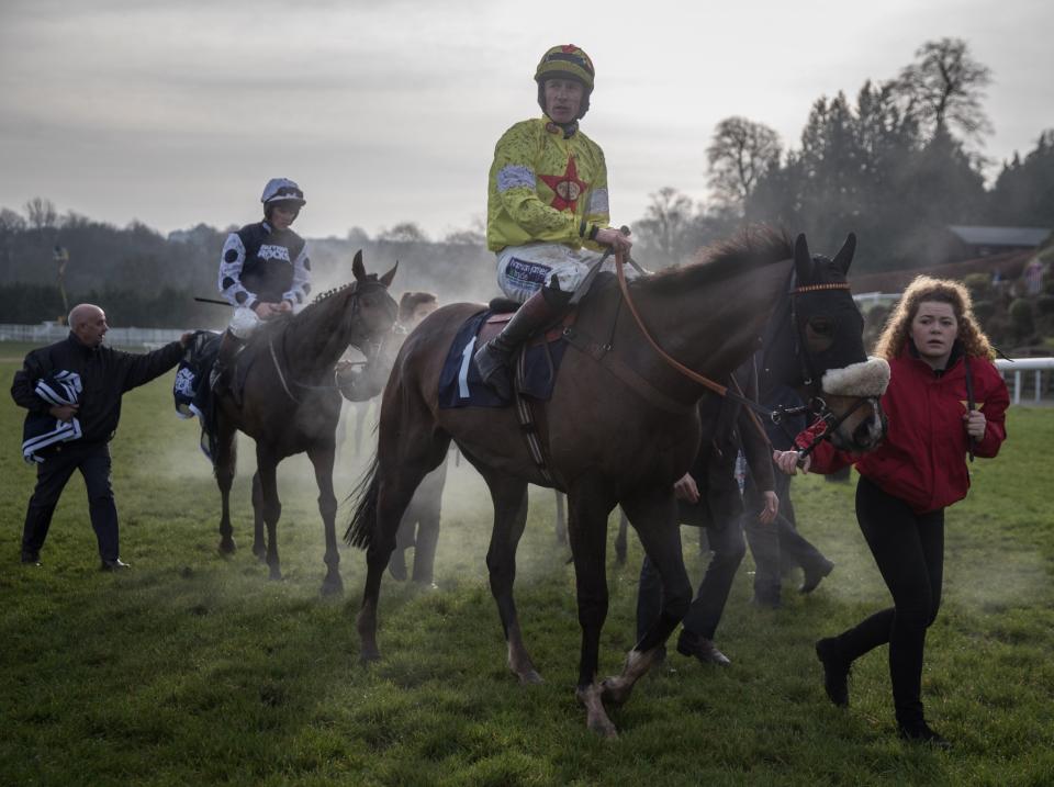 Horses are led back to the ring following a race in Chepstow, Wales