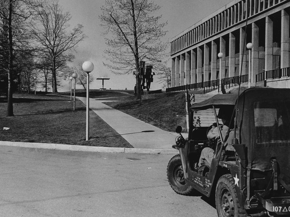 The Kent State campus sits empty as an Ohio National Guard jeep sits near Taylor Hall on the afternoon of May 4, 1970, after the university was closed following the shooting of 13 students by the National Guard.