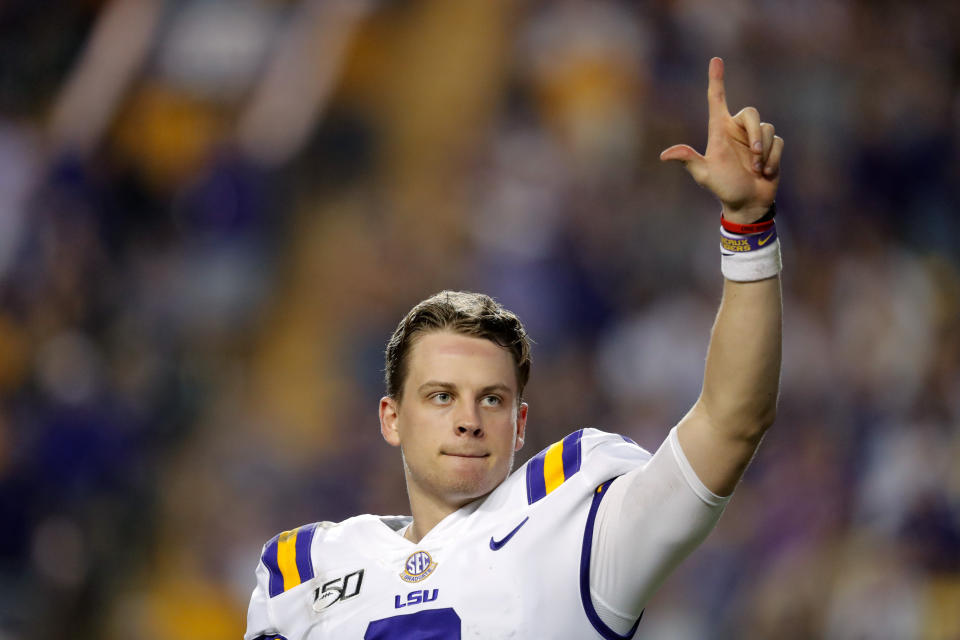 LSU quarterback Joe Burrow, who is considered a frontrunner for the Heisman Trophy, acknowledges the crowd as he is pulled from his last game in Tiger Stadium, in the fourth quarter of the team's NCAA college football matchup against Texas A&M in Baton Rouge, La., Saturday, Nov. 30, 2019. LSU won 50-7. (AP Photo/Gerald Herbert)