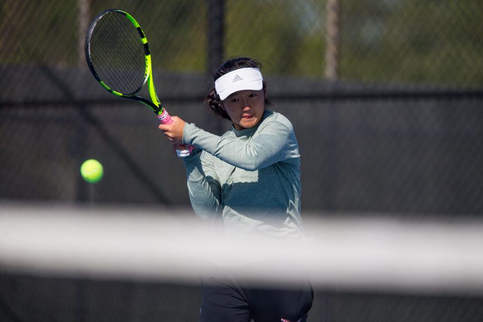 Auburn's Amy Park serves against Huntley's Ruhi Gulati during the singles sectional finals on Saturday, Oct. 16, 2021, at Harlem High School in Machesney Park. Park won, 6-0, 6-1.