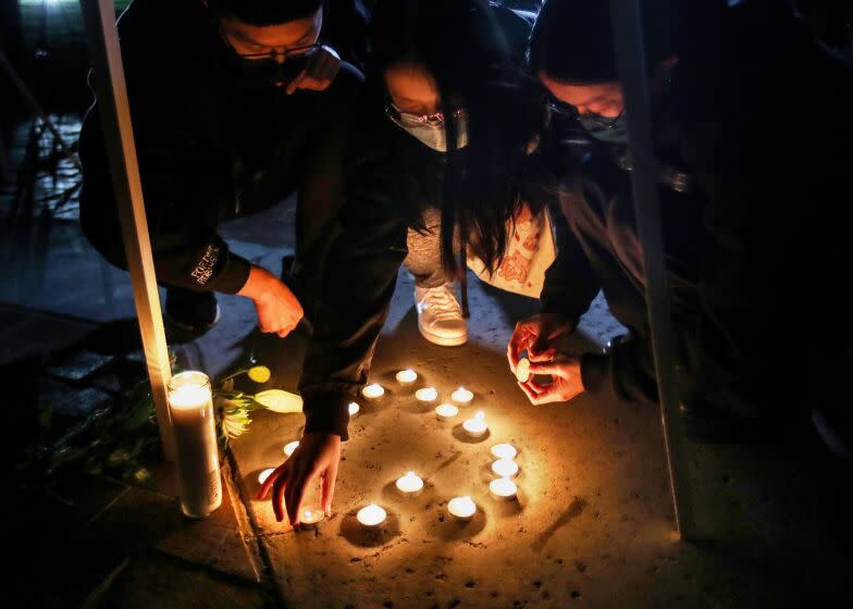 Monterey Park, CA - January 23: Mourners take part in a vigil for the victims of a mass shooting at the Star Dance Studio on Monday, Jan. 23, 2023, in Monterey Park, CA. The investigation into a mass shooting in Monterey Park is focused on the gunman's prior interactions at two dance studios he targeted and whether jealousy over a relationship was the motive, law enforcement sources said.(Allen J. Schaben / Los Angeles Times)