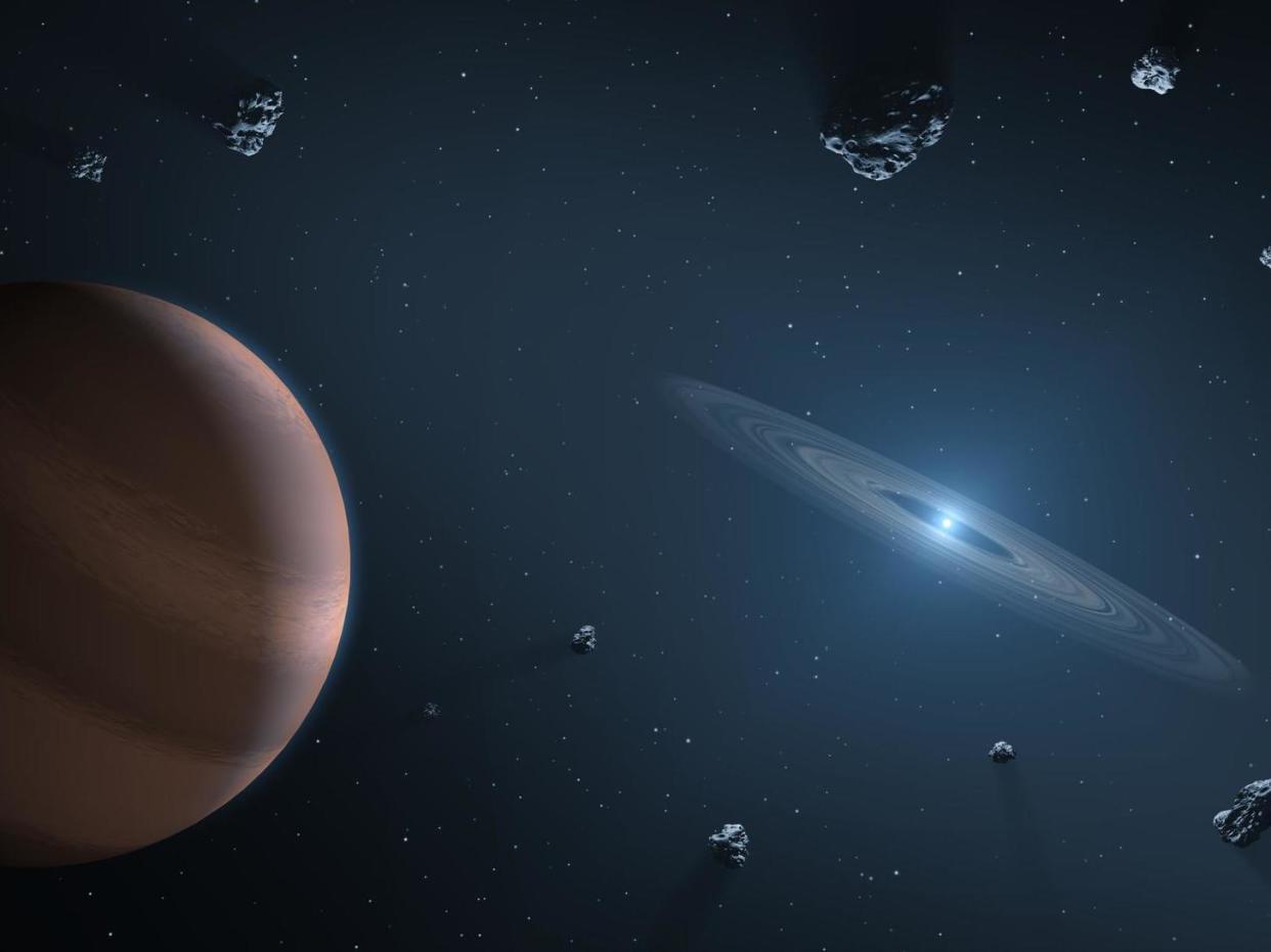 Artists impression of white dwarf star (on right) showing dust disc, and surrounding planetary bodies: Nasa