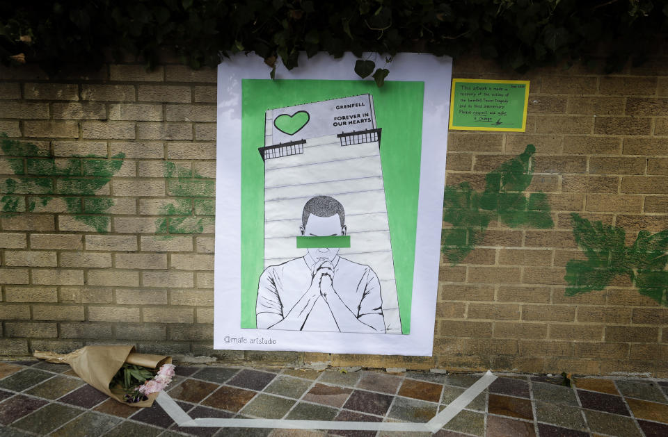 Artwork made in memory of the victims of the Grenfell Tower block fire, near Grenfell Tower, in London, Sunday, June 14, 2020. Britain is marking the third anniversary of the Grenfell Tower fire with a virtual church service to remember the 72 people who died in the blaze. Sunday marks three years since a small kitchen fire in the west London public-housing block turned into the worst domestic blaze in the country since World War II. (AP Photo/Kirsty Wigglesworth)