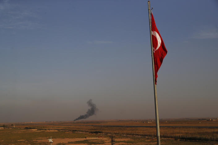 In this photo taken from the Turkish side of the border between Turkey and Syria, in Akcakale, Sanliurfa province, southeastern Turkey, smoke billows from a fire inside Syria during bombardment by Turkish forces, Oct. 9, 2019. (Photo: Lefteris Pitarakis/AP)