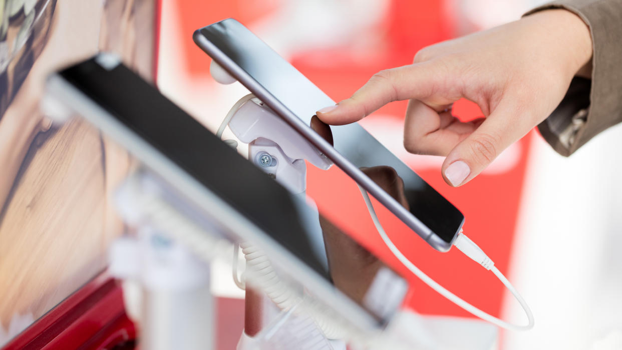 Woman examining new smart phone