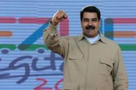 Venezuela's President Nicolas Maduro gestures during a meeting with supporters in Caracas, Venezuela March 31, 2017. Miraflores Palace/Handout via REUTERS