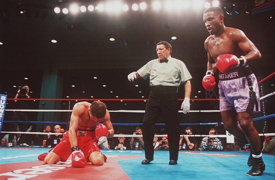 18 Nov 1995: Pernell Whitaker (right) heads to neutral corner after knocking his opponent Jake Rodriguez to the canvas during the sixth round of their championship bout. Whitaker won the fight with a sixth round knock out. Mandatory Credit: Al Bello/A