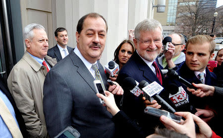 FILE PHOTO - Former Massey Energy Chief Executive Don Blankenship (3rd L) and his attorney Bill Taylor (4th R) are met by media outside the Robert C. Byrd U.S. Courthouse in Charleston, West Virginia, U.S. on December 3, 2015. REUTERS/Chris Tilley/File Photo