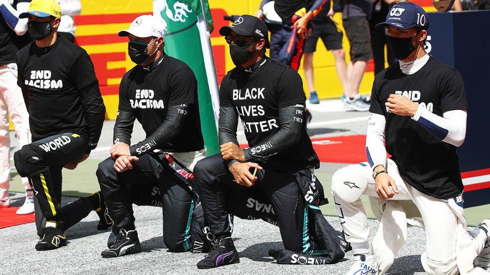 F1 drives, pictured here taking part in a Black Lives Matter protest before the Styrian Grand Prix.