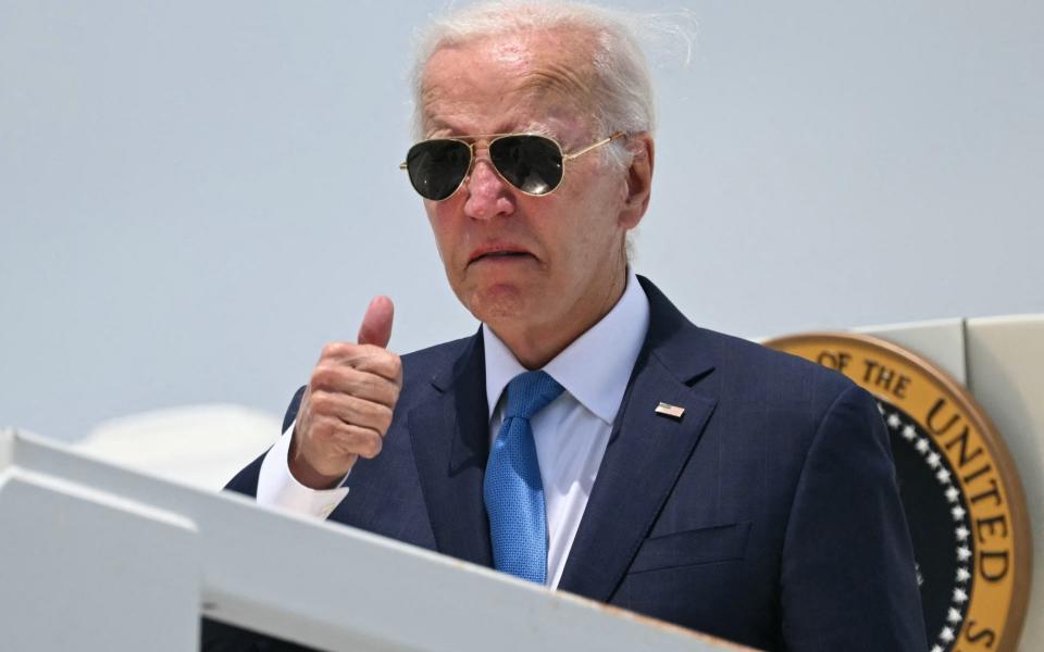 Joe Biden boards Air Force One as he departs Dover Air Force Base in Dover, Delaware