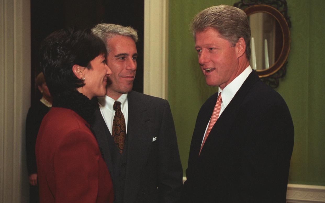 Ghislaine Maxwell in a red jacket speaks to Jeffrey Epstein and President Clinton