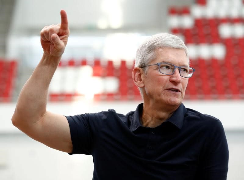 Apple's CEO Tim Cook speaks with Singapore Paralympian Theresa Goh (unseen) at the OCBC Aquatic Centre, Singapore Sports Hub