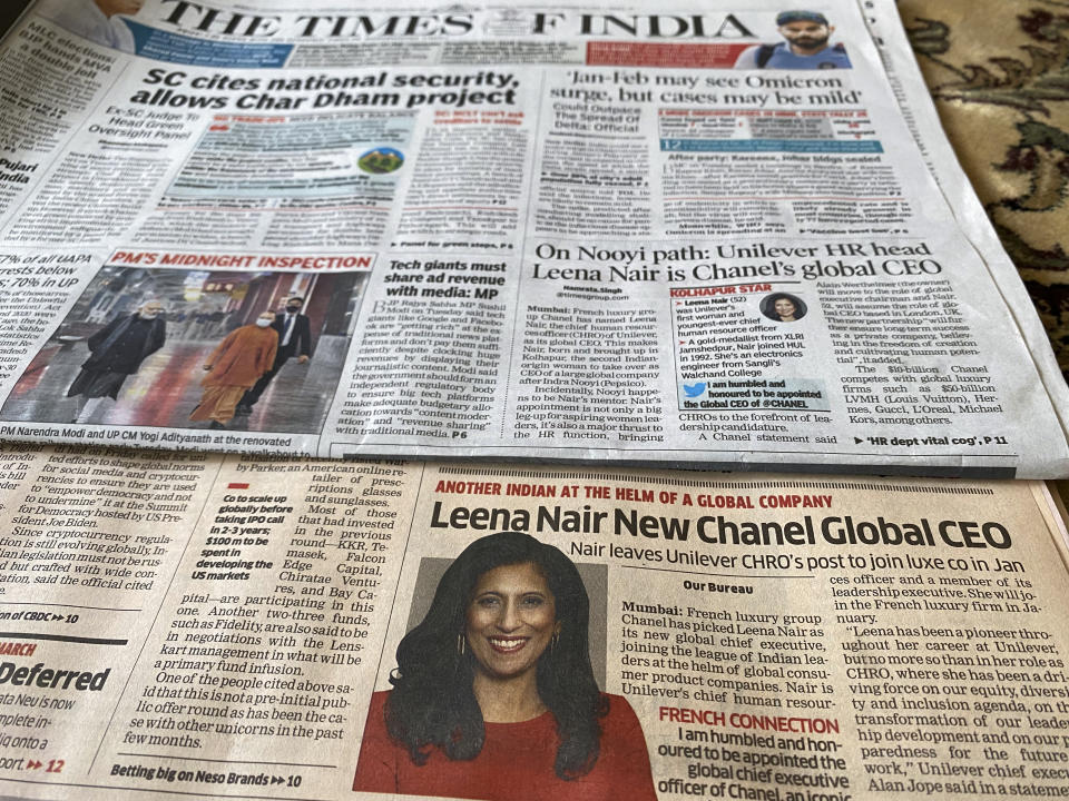 Two of the Indian newspapers that carried news of Unilever executive Leena Nair being chosen as the new CEO of luxury fashion house Chanel on their front page in Mumbai, India, Wednesday, Dec.15, 2021. (AP Photo/Rafiq Maqbool)