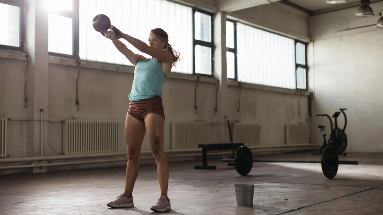  Person doing a kettlebell swing. 