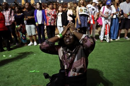 A woman reacts during a religious retreat lead by T.B. Joshua, a Nigerian evangelical preacher on Mount Precipice, Nazareth