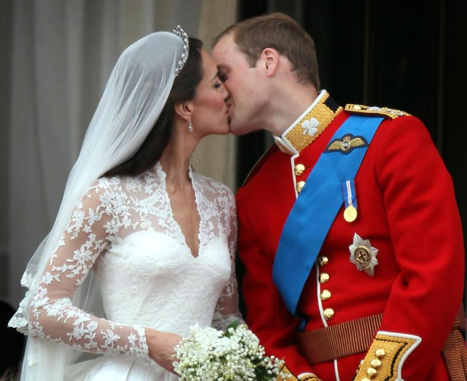 Their Royal Highnesses Prince William, Duke of Cambridge and Catherine, Duchess of Cambridge kiss on the balcony at Buckingham Palace on April 29, 2011 in London, England (Getty Images)