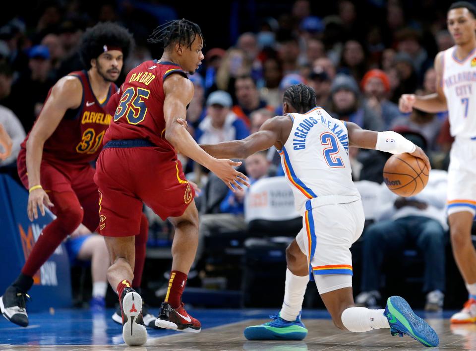 Oklahoma City's Shai Gilgeous-Alexander (2) tries to get around Cleveland's Isaac Okoro (35) in the second half during the NBA game between the Oklahoma City Thunder and the Cleveland Cavaliers at the Paycom Center in Oklahoma City, Saturday, Jan. 15, 2022. 