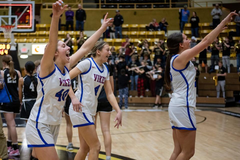 Seaman's Ava Esser, Jaida Stallbaumer, and Madeline Gragg celebrate winning the 5A State Basketball Tournament in Emporia on Saturday, March 9, 2024.