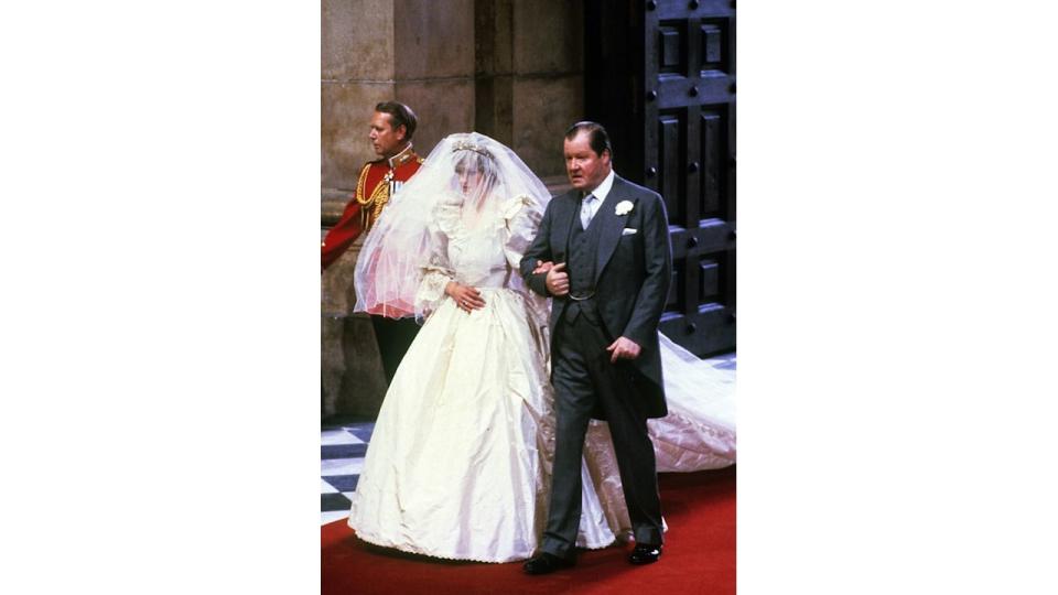 Princess Diana walking down the aisle with Earl Spencer