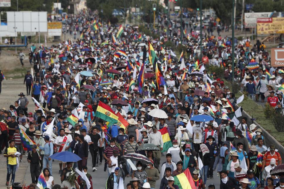 Coca leaf producers, supporters of former President Evo Morales march to Cochabamba from Sacaba, Bolivia, Saturday, Nov. 16, 2019. Officials now say at least eight people died when Bolivian security forces fired on Morales supporters the day before in Sacaba. The U.N. human rights chief says she’s worried that Bolivia could “spin out of control” as the interim government tries to restore stability following the resignation of the former president in an election dispute. (AP Photo/Juan Karita)