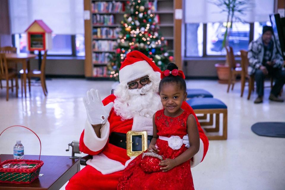 A child visits with Santa for Noel Night in Midtown Detroit.