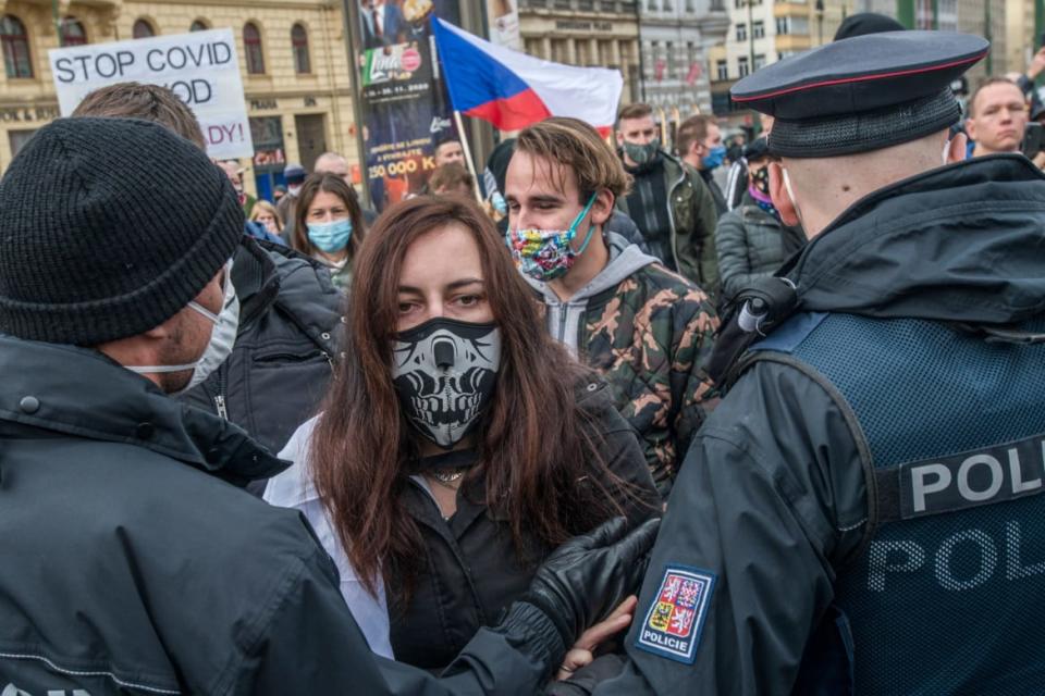 <div class="inline-image__caption"><p>Protestors face police as they attend a demonstration against the Czech government's anti-virus restrictions on October 28, 2020 in Prague, amid the second COVID-19 wave in Europe.</p></div> <div class="inline-image__credit">MICHAL CIZEK/AFP via Getty Images</div>