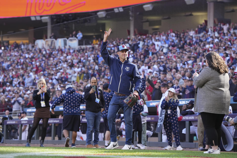 Former Minnesota Twins catcher Joe Mauer acknowledges the fans before catching the ceremonial first pitch from Johan Santana before Game 3 of an American League Division Series baseball game against the Houston Astros, Tuesday, Oct. 10, 2023, in Minneapolis. (AP Photo/Jordan Johnson)