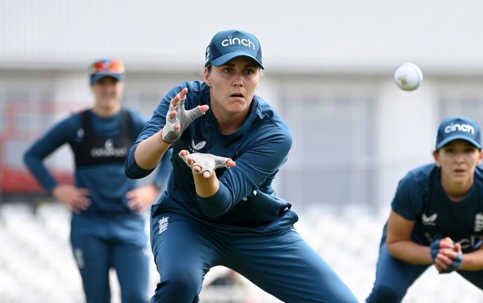 Nat Sciver-Brunt of England catches alongside Kate Cross