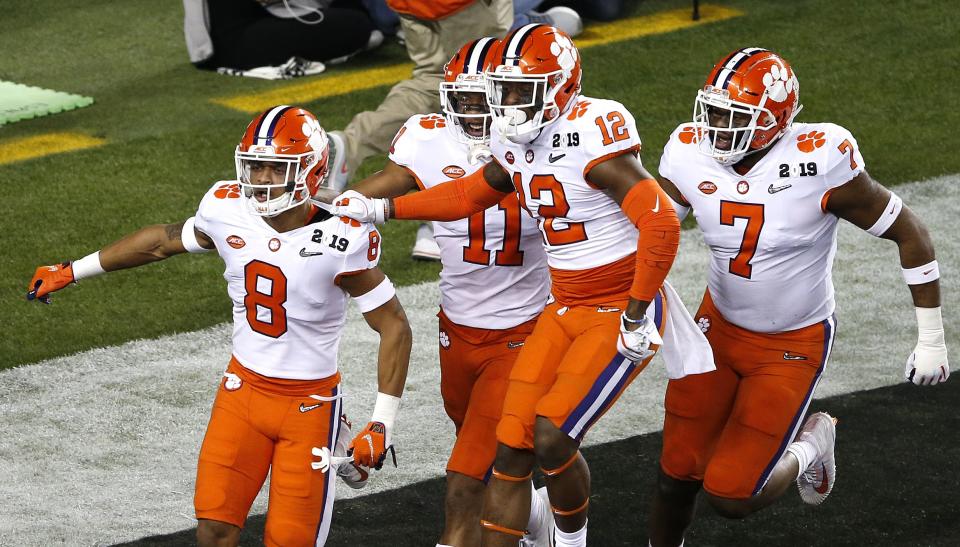 Clemson’s A.J. Terrell (8) celebrates with teammates after returning an interception for a touchdown in the first quarter. (Getty)
