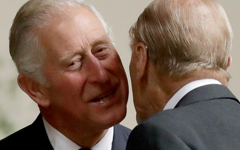 Prince Charles and Prince Philip greet in 2017 - AP