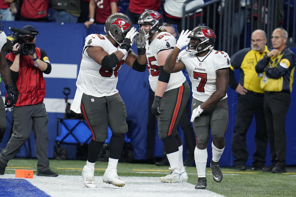 Tampa Bay Buccaneers' Leonard Fournette (7) celebrates a rushing touchdown during the second half of an NFL football game against the Indianapolis Colts, Sunday, Nov. 28, 2021, in Indianapolis. (AP Photo/Michael Conroy)