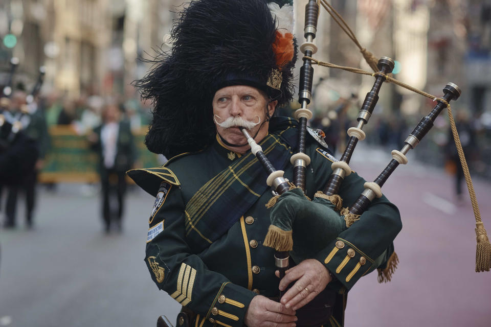 A bagpiper marches along Fifth Avenue during the St. Patrick's Day Parade on Saturday, March 16, 2024, in New York. (AP Photo/Andres Kudacki)