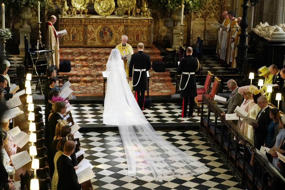 The couple stand in front of Archbishop of Canterbury Justin Welby during their wedding on Saturday. Source: AP