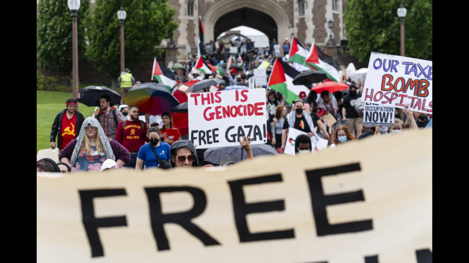 Pro-Palestinian demonstrators march on Saturday, April 27, 2024, at Washington University in St. Louis.