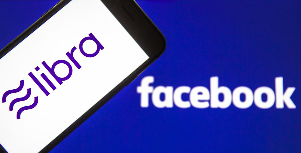 ANKARA, TURKEY - FEBRUARY 27: In this photo illustration a smart phone displays the logo of Libra and a computer screen displays the Facebook logo in Ankara Turkey on February 27, 2020. Ali Balikci / Anadolu Agency