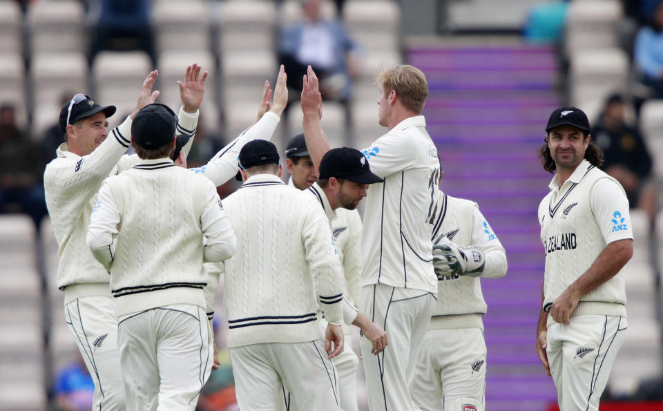 New Zealand's Kyle Jamieson, second right, celebrates with teammates the dismissal of India's captain Virat Kohli during the third day of the World Test Championship final cricket match between New Zealand and India, at the Rose Bowl in Southampton, England, Sunday, June 20, 2021. (AP Photo/Ian Walton)