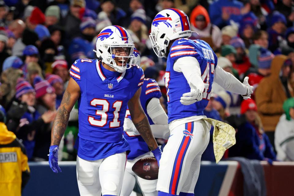 Buffalo Bills cornerback Rasul Douglas (31) celebrates an interception with Christian Benford (47) during the first half of an NFL football game against the New York Jets in Orchard Park, N.Y., Sunday, Nov. 19, 2023. (AP Photo/Jeffrey T. Barnes)