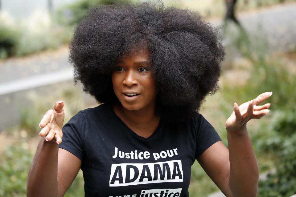 Assa Traore, wearing a shirt that reads: “Justice for Adama, without Justice you will never be in Peace,” attends an interview in Ivry-sur-Seine, on the outskirts of Paris, Wednesday, July 15, 2020. Traore started by fighting for justice for her brother Adama, who died in police custody on his 24th birthday four years ago. She’s now at the forefront of a new movement for Black rights in France that aims to wipe out systemic racism in policing and challenge the country’s official vision of itself as a colorblind society. (AP Photo/Francois Mori)