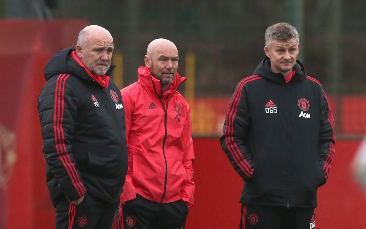 Mark Dempsey (c) alongside Mike Phelan and Ole Gunnar Solskjaer   - Manchester United