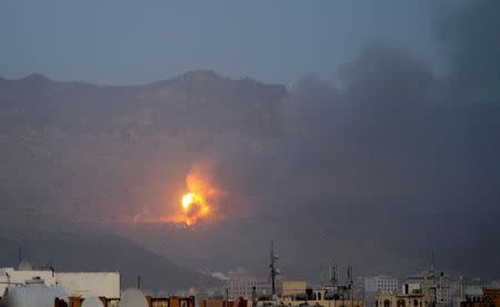 Fire is seen from the Noqum Mountain after it was hit by an air strike in Yemen's capital Sanaa May 19, 2015. REUTERS/Mohamed al-Sayaghi