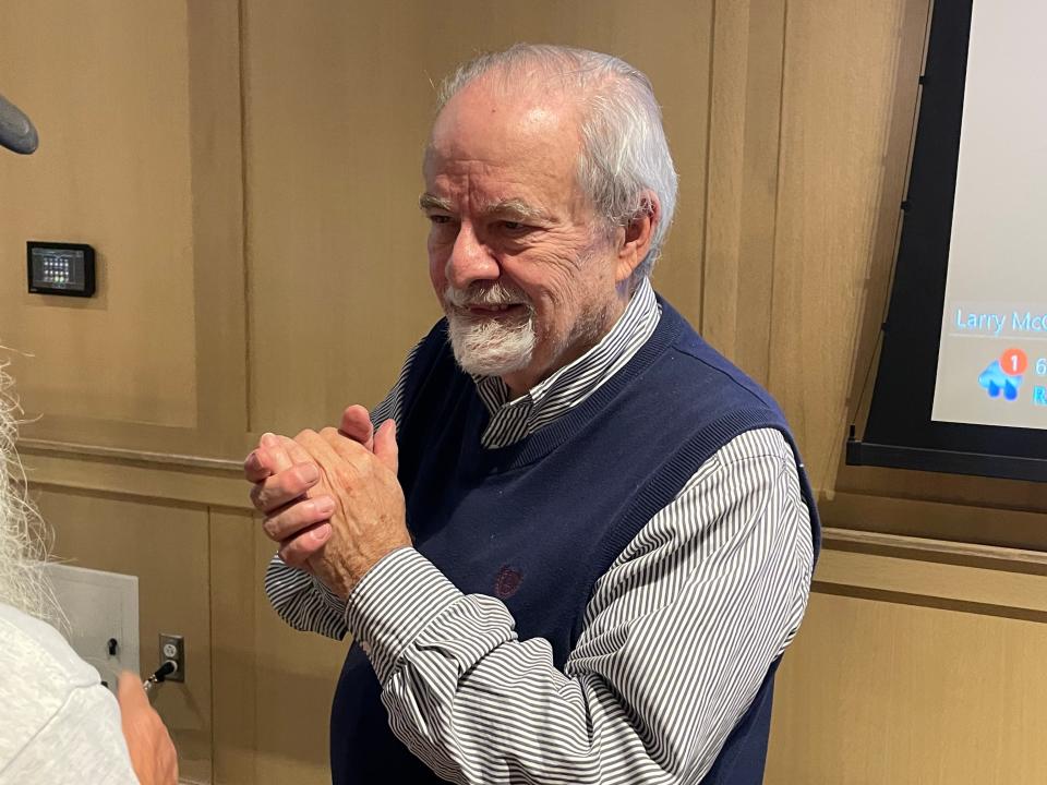 Larry McLellan, a professor emeritus of sociology and community studies at Governor's State University, talks with an attendee after an event introducing the Chicago to Detroit Freedom Trail in downtown South Bend on Oct. 25, 2023.
