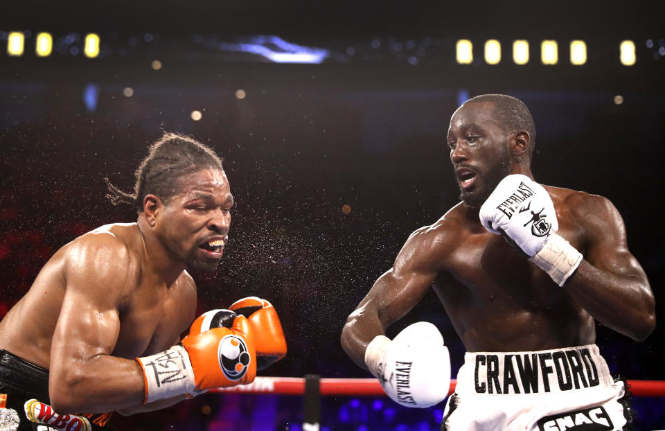 LAS VEGAS, NEVADA - NOVEMBER 20: WBO champion Terence Crawford (R) punches Shawn Porter during their welterweight title fight at Michelob ULTRA Arena on November 20, 2021 in Las Vegas, Nevada. Crawford retained his title with a 10th-round TKO. (Photo by Steve Marcus/Getty Images)