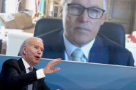 President Joe Biden speaks with Washington Gov. Jay Inslee via teleconference during a meeting with governors to discuss ongoing efforts to strengthen wildfire prevention, preparedness and response efforts, and hear firsthand about the ongoing impacts of the 2021 wildfire season in the South Court Auditorium in the Eisenhower Executive Office Building on the White House Campus in Washington, Friday, July 30, 2021. (AP Photo/Andrew Harnik)